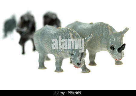 Toy rhinoceros from a vintage Noah's Ark play set, photographed on a white background. Stock Photo