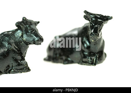 Toy cows from a vintage Noah's Ark play set, photographed on a white background. Stock Photo