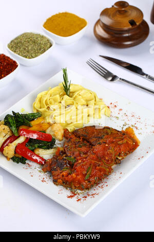 Beef Steak with tomato sauce and fettucini pasta Stock Photo