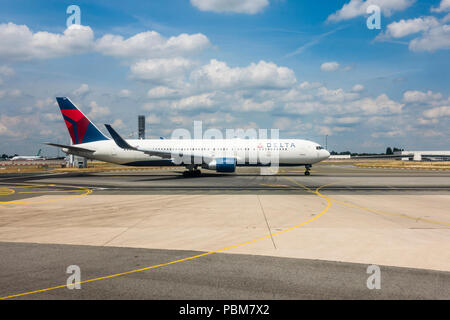 Delta Airlines airplane waiting to take of at runway, airport Charles de Gaulle, Paris, France. Stock Photo