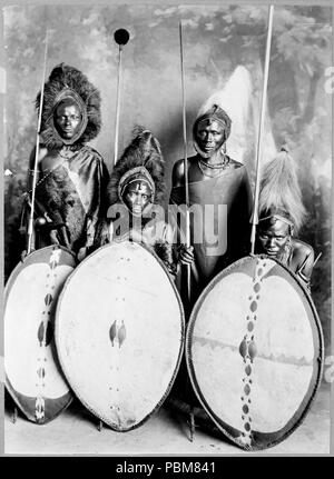 Four masai warriors in full war dress, Kenya 1890-1923 Stock Photo