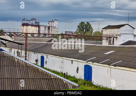 Vitebsk, Belarus - July 7, 2018: Belarusian warehouse with grain with blue doors and granaries. Stock Photo