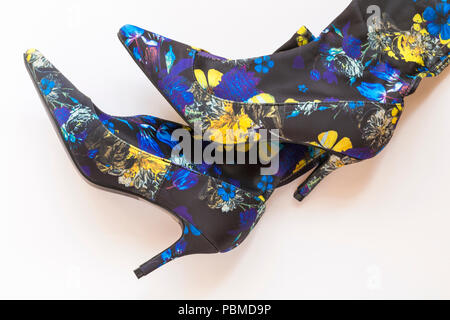 colourful woman's shoe boots set on white background - flowery fabric Stock Photo