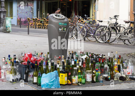 Paris waste - Waste glass bottles left on the street. Paris, France, Europe. Stock Photo