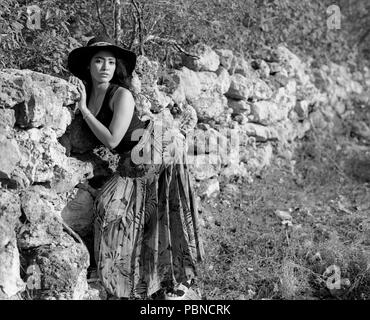 17 years old teenager girl in an outdoor, environmental portrait session. B&W medium format film. Stock Photo