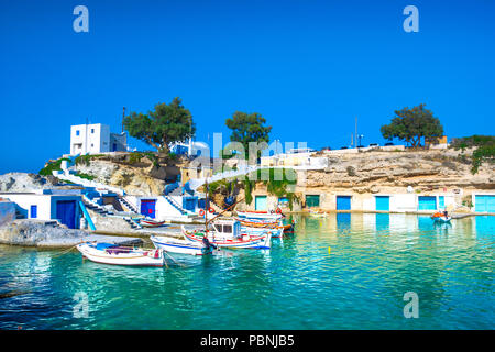 Scenic Mandrakia village (traditional Greek village by the sea, the Cycladic-style) with sirmata - traditional fishermen's houses, Milos island, Greec Stock Photo