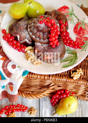 muffins with red currants and pears. Delicious homemade pastries for breakfast Stock Photo