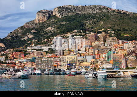 Monaco principality from the port, apartment buildings, block of flats, houses on a steep coastal mountain slope Stock Photo