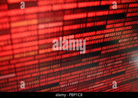 red binary code. computer technology background. red binary code computer language data transfers. unsecured and dangerous big data and ai artificial Stock Photo