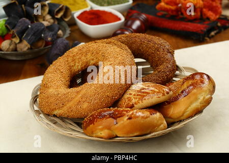 Turkish pastry simit bagel and pogaca on wood plate Stock Photo