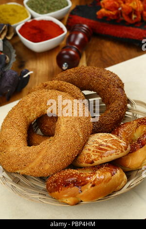 Turkish pastry simit bagel and pogaca on wood plate Stock Photo