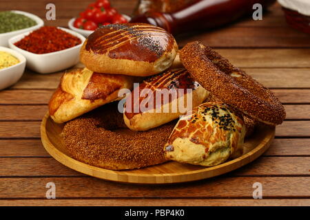 Turkish pastry simit bagel and pogaca on wood plate Stock Photo