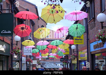Coppergate in York where the street is full of colourful Umbrellas. Stock Photo
