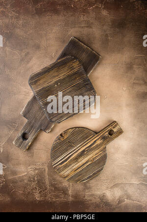 Set of wooden cutting board on broun background. Copy space for text, top view Stock Photo