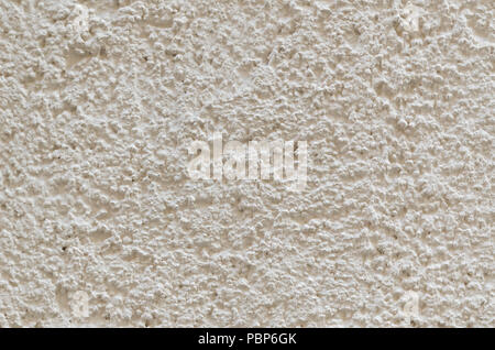 Bright white-yellow wall texture. Porous surface background Stock Photo