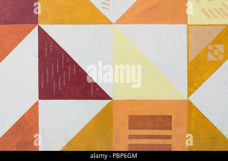 Wall art painted texture. Triangular patterns, colorful background Stock Photo