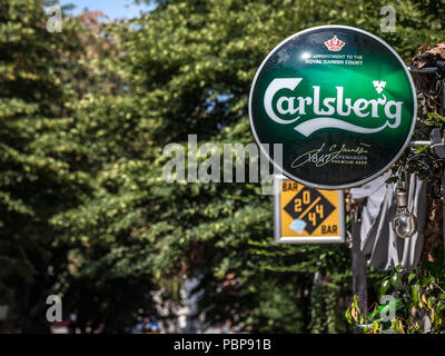 BELGRADE, SERBIA - JULY 11, 2018: Logo of Carlsberg on a bar sign with its distinctive visual. Carlsberg is a Danish light pilsner beer produced in Co Stock Photo