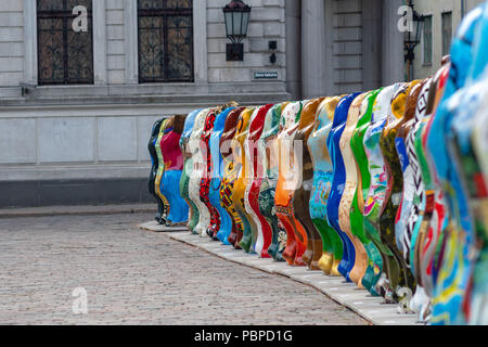 RIGA, LATVIA - JULY 26, 2018: United Buddy Bears exhibition. The old town square is located the bear sculpture row. Stock Photo