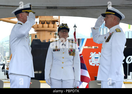 Rear Adm. Kevin E. Lunday (left) relieves Rear Adm. Brian K. Penoyer (right) as commander of the Fourteenth Coast Guard District while Vice Adm. Linda L. Fagan (center) presides during a change of command ceremony at Coast Guard Base Honolulu, July 19, 2018.  Lunday was previously commander of Coast Guard Cyber Command. (U.S. Coast Guard photo by Petty Officer 3rd Class Matthew West/Released)
