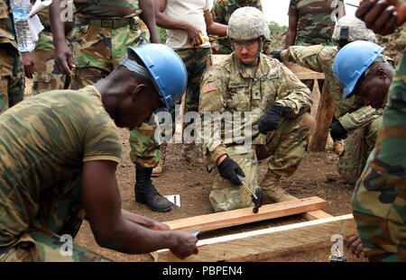 Soldiers with the North Dakota National Guard team up with the Ghana Armed Forces to assemble structures at the Bundase Training Camp in Ghana July 20, 2018 as part of United Accord 2018. UA18 is a Ghana Armed Forces & U.S. Army Africa hosted exercise consisting of four combined, joint components: a computer-programmed exercise (CPX), field training exercise (FTX), Jungle Warfare School (JWS) and medical readiness training exercise (MEDRETE). West-African partner militaries, NATO Allies and U.S. Army Africa will execute each component in Accra, Ghana and surrounding areas. (U.S. Army Photo by  Stock Photo