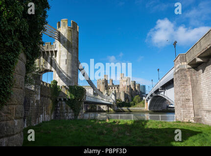 Conwy Castle, suspension bridge and road bridge over the river Conwy in North Wales, UK. Stock Photo