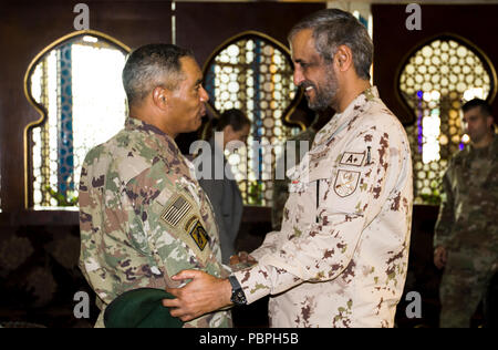 Maj. Gen. Saleh M. Al-Ameri, United Arab Emirates land forces commander, greets U.S. Army Lt. Gen. Michael X. Garrett, U.S. Army Central commanding general, prior to their key leader engagement in Abu Dhabi, United Arab Emirates, July 23, 2018. Key  leader engagements are an important part of building trust and enabling partner interoperability. (U.S. Army photo by Staff Sgt. Andrew S. Carroll) Stock Photo