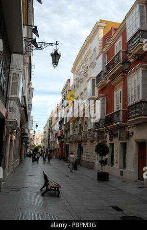 One of the many narrow cobbled-stoned side streets in Cadiz, Andalusia, Cadiz-province, Southern Spain Stock Photo