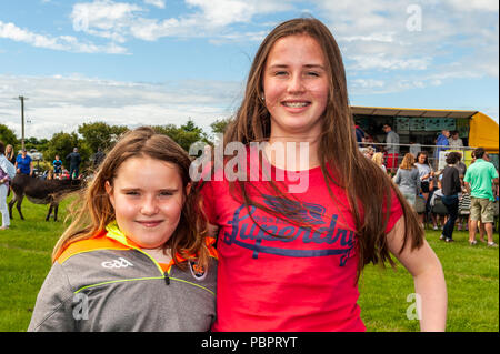 Schull, West Cork, Ireland. 29th July, 2018. Schull Agricultural Show is underway in blazing sunshine with hundreds of people attending. Caitlin O'Reilly, Schull and Aisling O'Reilly, Enniskeane enjoyed the show. Credit: Andy Gibson/Alamy Live News. Stock Photo