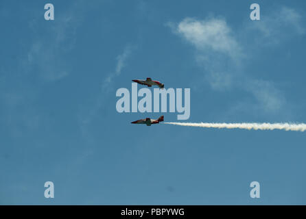 Malaga, Spain. 29th July, 2018. Team members of the Spanish Air Force 'Patrulla Aguila' perform on the air during the 2018 Torre del Mar International Air Festival in Torre del Mar, near Malaga.The 2018 Torre del Mar International Air Festival is being hosted on 27, 28 and 29th of July, attracting over 300,000 spectators. Credit: Jesus Merida/SOPA Images/ZUMA Wire/Alamy Live News Stock Photo