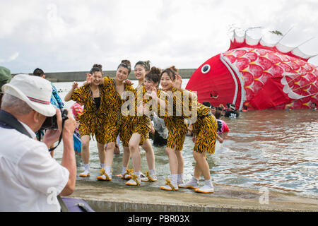 Minamichita, aichi, Japan. 29th July, 2018. Participants seen posing for the camera during the festival.The sea bream or tai maturi festival is a traditional festival in Minamichita, Aichi, Japan. It's also called the strange festival or unusual festival, a float of bream is carried by young people who walk around town and the sea. Its purpose is to pray for marine safety and good catch. Credit: Takahiro Yoshida/SOPA Images/ZUMA Wire/Alamy Live News Stock Photo