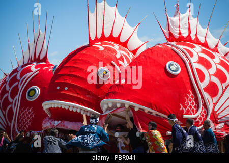 Minamichita, aichi, Japan. 29th July, 2018. Participants seen moving sea bream figures during the festival.The sea bream or tai maturi festival is a traditional festival in Minamichita, Aichi, Japan. It's also called the strange festival or unusual festival, a float of bream is carried by young people who walk around town and the sea. Its purpose is to pray for marine safety and good catch. Credit: Takahiro Yoshida/SOPA Images/ZUMA Wire/Alamy Live News Stock Photo
