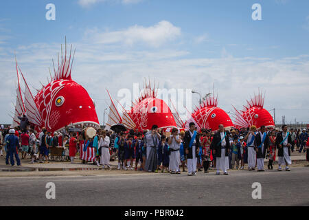 Minamichita, aichi, Japan. 29th July, 2018. People seen looking at the different sea bream figures during the festival.The sea bream or tai maturi festival is a traditional festival in Minamichita, Aichi, Japan. It's also called the strange festival or unusual festival, a float of bream is carried by young people who walk around town and the sea. Its purpose is to pray for marine safety and good catch. Credit: Takahiro Yoshida/SOPA Images/ZUMA Wire/Alamy Live News Stock Photo