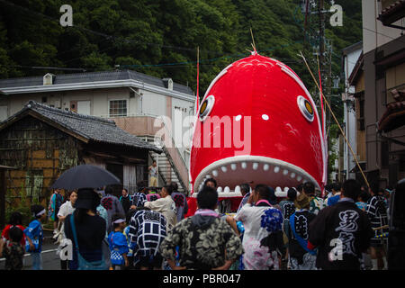 Minamichita, aichi, Japan. 29th July, 2018. Participants seen moving the sea bream figure through town.The sea bream or tai maturi festival is a traditional festival in Minamichita, Aichi, Japan. It's also called the strange festival or unusual festival, a float of bream is carried by young people who walk around town and the sea. Its purpose is to pray for marine safety and good catch. Credit: Takahiro Yoshida/SOPA Images/ZUMA Wire/Alamy Live News Stock Photo