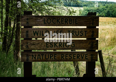 Sign board for Lockerbie Wildlife Trust. Eskrigg Nature Reserve.Scotland Stock Photo