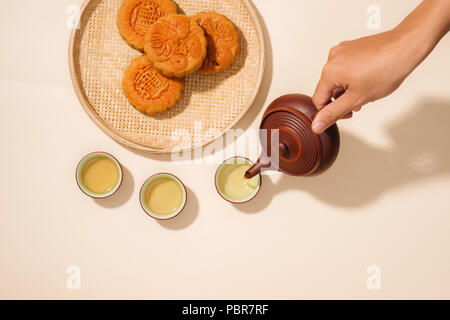 Mooncakes,which are Vietnamese pastries traditionally eaten during the Mid-Autumn Festival. Text on cake mean happiness. Stock Photo