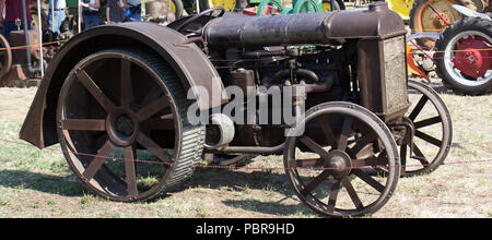 Antique metal Tractor With Unique Wheels Stock Photo