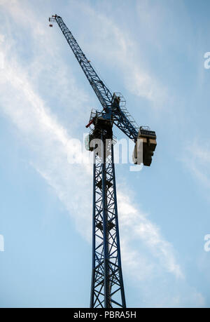 Crane with ballast on a construction site Stock Photo