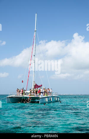 Red Sail Sports sail boat at Stingray City off Grand Cayman Island Stock Photo
