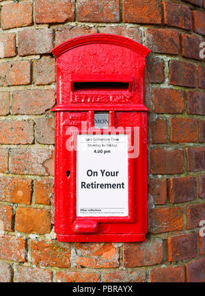 British post box with a message that reads On Your Retirement, ideal for a greeting card design Stock Photo