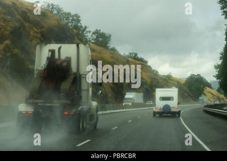 Driving on North Umpqua highway 138 near Glide during a stormy and rainy day, Oregon, usa. Stock Photo