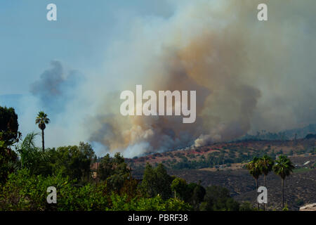 Fallbrook, California, USA – July 29 2018: CalFire battles wildfire as smoke rises near Fallbrook, California in San Diego County. Stock Photo