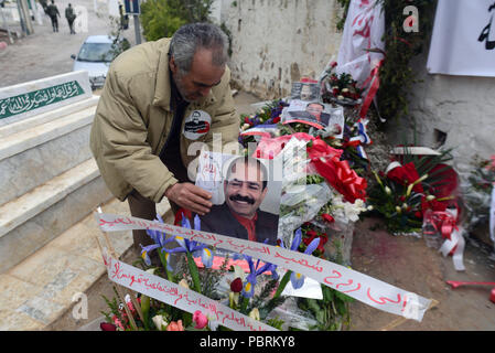 February 15, 2013 - Tunis, Tunisia: Tunisian people pay tribute to slain opposition figure Chokri Belaid one week after his burial. Des Tunisiens se recueillent sur la tombe de Chokri Belaid une semaine apres son assassinat. *** FRANCE OUT / NO SALES TO FRENCH MEDIA *** Stock Photo