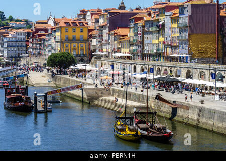 Traditional rabelo cargo boats moored off the bank of the River Douro on the Cais da Ribeira Porto Portugal Stock Photo