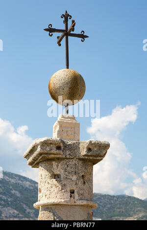 Iron cross on top of chapel on Lady of the Rocks island in Bay of Kotor, Perast, Montenegro, 2018 Stock Photo