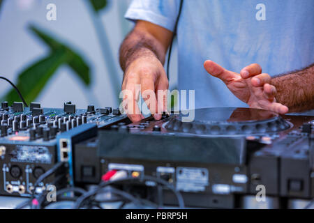 Photo of adult dj working with his equipment. Close up shoot Stock Photo