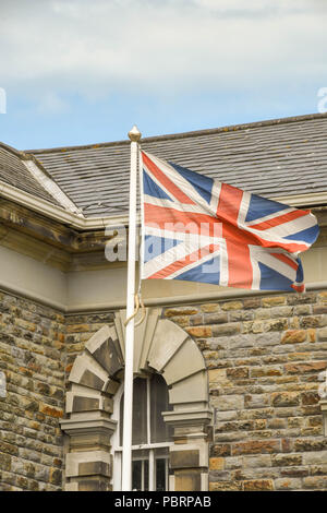 Union Jack flag flying outside the entrance to HM Prison Swansea Stock Photo