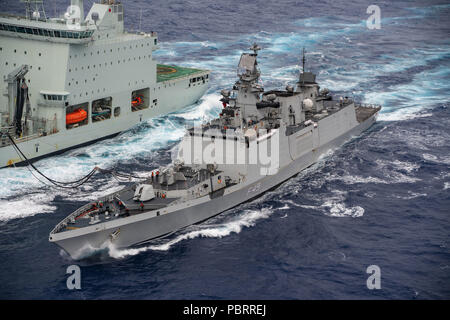 180728-N-CW570-1364 PACIFIC OCEAN (July 28, 2018) Indian Navy stealth multi-role frigate INS Sahyadri (F49) performs a replenishment-at-sea with Royal Canadian Navy supply ship MV Asterix off the coast of Hawaii during Rim of the Pacific (RIMPAC) exercise, July 28. Twenty-five nations, 46 ships, five submarines, and about 200 aircraft and 25,000 personnel are participating in RIMPAC from June 27 to Aug. 2 in and around the Hawaiian Islands and Southern California. The world’s largest international maritime exercise, RIMPAC provides a unique training opportunity while fostering and sustaining c Stock Photo