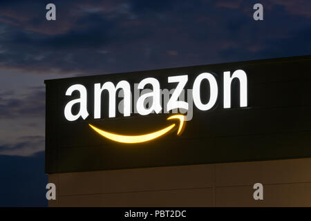 Illuminated signage at the Amazon fulfillment centre located in Warrington, UK. Stock Photo