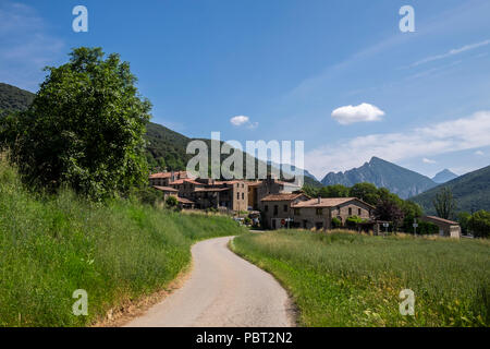 Country road leading to the village of Oix in the Catalonian Pyreenees, Spain Stock Photo