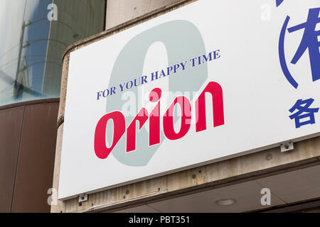 'For your happy time', Orion beer sign; Koza, Okinawa Prefecture, Japan Stock Photo